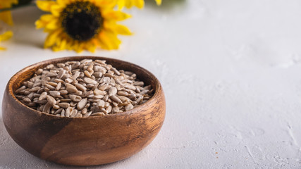 Sunflower seeds in a bowl with copy space
