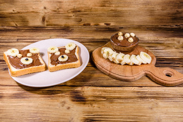 Two sandwiches with chocolate spread on a plate. Sandwich like a bear muzzle