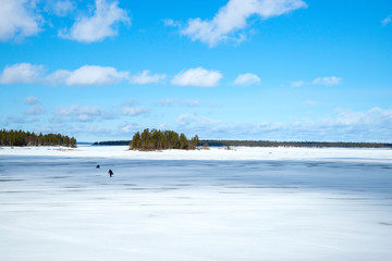 Landscape of remote ice fishing in Lapland, Finland