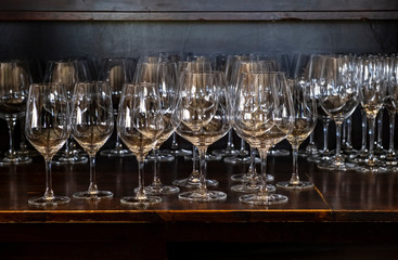 Closeup of Empty Wine Glasses in Various Shapes on a Bar Table