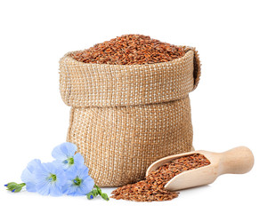 flax seeds in sack and flowers
