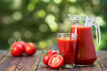 tomato juice in glass and jug