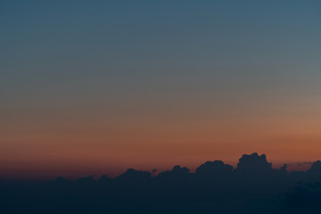 Orange horizon and blue atmosphere. Smooth orange blue gradient of dawn sky.