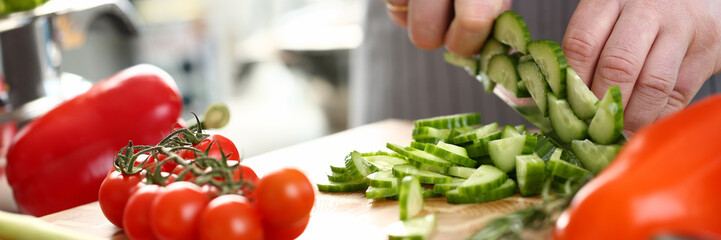 Professional Chef Hand Chopping Fresh Cucumber
