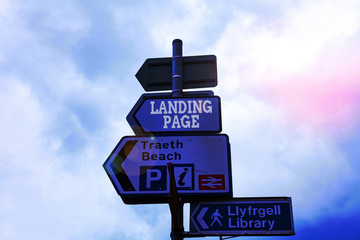 Text sign showing Landing Page. Business photo text Website accessed by clicking a link on another web page Empty street signs on the crossroads with blank copy space