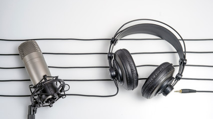 music studio background with headphones and microphone