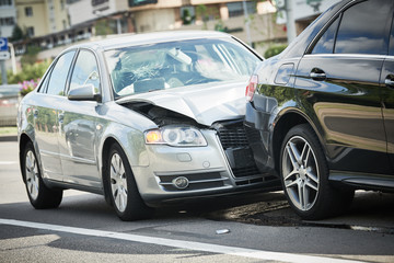 car crash accident on street. damaged automobiles - 297153802