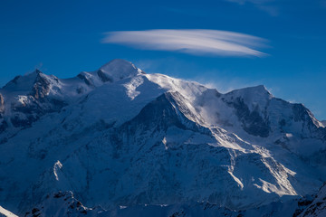 Fototapeta na wymiar Cloud over Mont Blanc peak