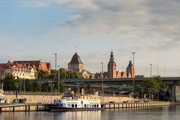 Fototapeta na wymiar Yacht and historical buildings in Szczecin