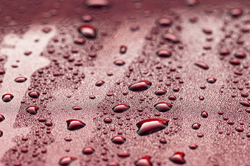 drops of water on red background