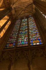 Carcassonne, France, 25 June 2019: Decorative stained glass window rose in the historic Saint Nazaire basilica in Carcassonne