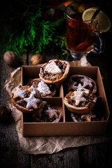 Christmas Mince pies on a Christmas rustic background