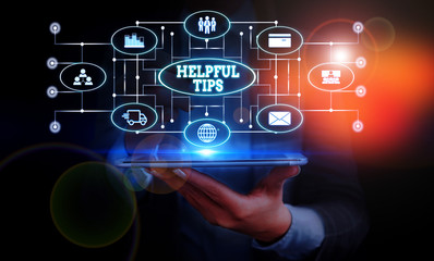 Conceptual hand writing showing Helpful Tips. Concept meaning Useful secret Information Advice given to accomplish something Woman wear work suit presenting presentation smart device