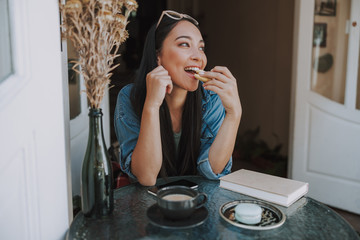 Asian young woman spending time in cafe