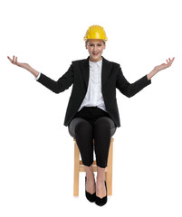 businesswoman wearing yellow helmet and greeting