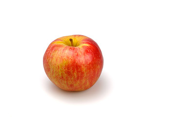 Organic red and yellow apple on a white background.