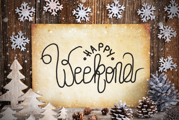 Old Paper With English Text Happy Weekend. Christmas Decoration Like Tree, Fir Cone And Snow. Brown Wooden Background