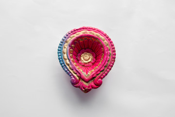Colorful clay diya lamps lit during diwali celebration