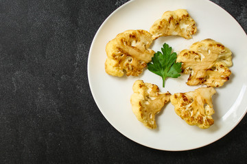 cauliflower grilled (fried grill vegetables or snack salad, bruschetta with tomato) menu concept. food background. copy space. Top view