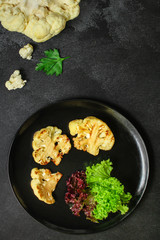 cauliflower grilled (fried grill vegetables or snack salad, bruschetta with tomato) menu concept. food background. copy space. Top view