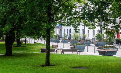View of Eyre Square, Galway City on a quiet summer morning showing the surrounding flora and buildings