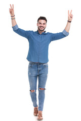 Successful casual man gesturing peace with both hand