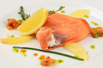 salmon with lemon and parsley on plate