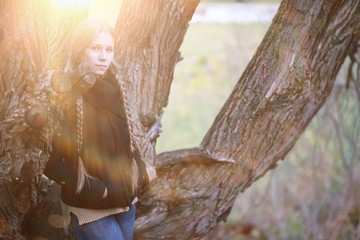 Young girl on a walk in the autumn