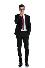 Obraz premium Amazed businessman covering his mouth