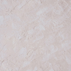 Rough painted pastel plaster texture for background.