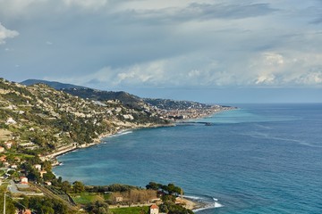 Fototapeta na wymiar Mediterranean coastal landscape in Northern Italy Riviera, view of Ventimigla, town by the French border