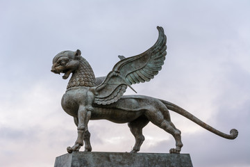 Fototapeta premium The sculpture of Ak Bars (Aq Bars, winged snow leopard), the symbol of Tatarstan at the Kazan wedding palace in the morning.