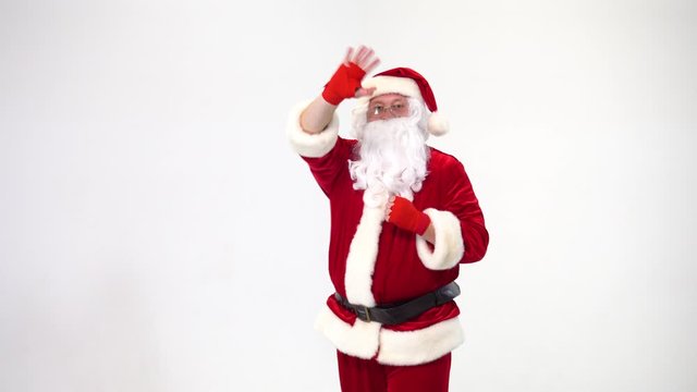 Christmas. Santa Claus on a white background in red bows for boxing and kickboxing fulfills blows. The image of a fighter.