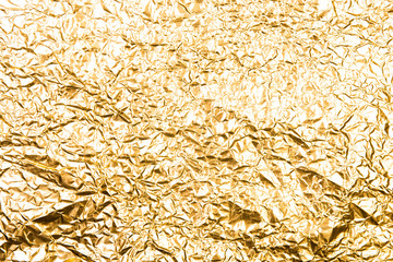 Shiny wrinkled metal foil abstract texture background. Greeting card design concept.