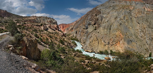 Tajikistan. The Pamir highway. Panorama of the mountain river Iskanderdarya flowing from lake Iskanderkul.