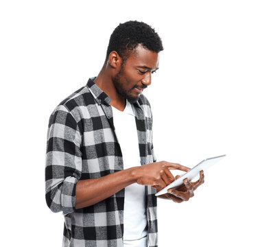 Portrait Of Handsome African-American Man With Tablet Computer On White Background