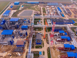 Obraz premium Construction of a plant for the production of carbon black. Future environmental problems of environmental pollution. Shooting drone from the air.