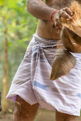 The Traditional Method of Peeling Coconut