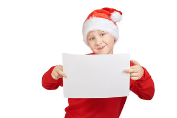 Christmas mockup of a cute little kid, teen boy wearing Santa hat and red sweater isolated on white background. Christmas holiday. The boy points his hand.