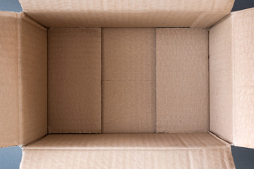 Empty open cardboard box, inside view. Close up