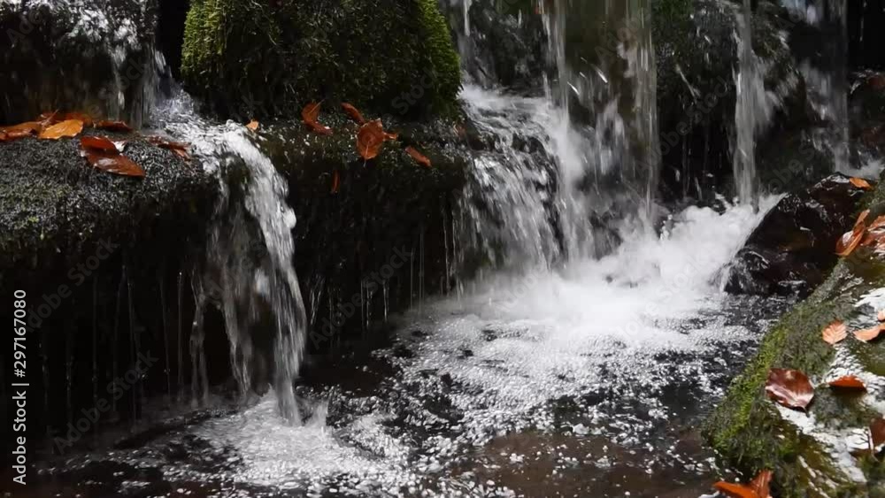 Sticker Close-up of a waterfall in a autumn forest