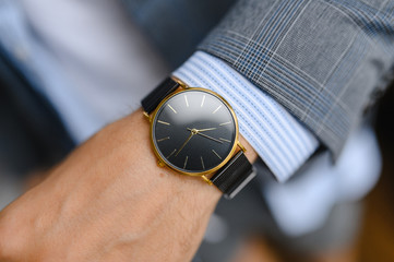 black watch, shirt, jacket. wrist shot