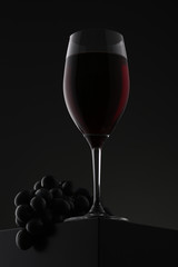 Glass of red wine with grapes over gradient background