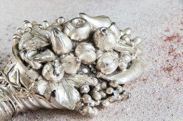 Vintage horn of cornucopia on concrete background.