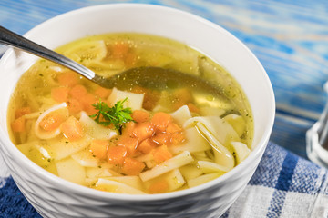 Broth - chicken soup in a bowl.