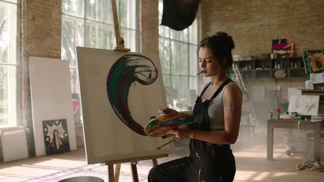 Young girl makes art with palette works in the art workshop, prores4444, RAW, Arri Alexa mini, 50fps