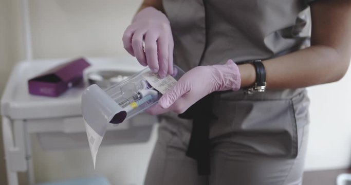 Beautician open a new ampoule, Shot on cinema canera, 12 bit color depth