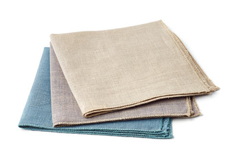 Tthree colorful textile napkins on white background