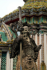 Fototapeta na wymiar buddhist warrior sculpture in garden of temple in Bangkok