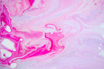 Abstract pink painting on canvas using liquid acrylic technique. Marble slice texture